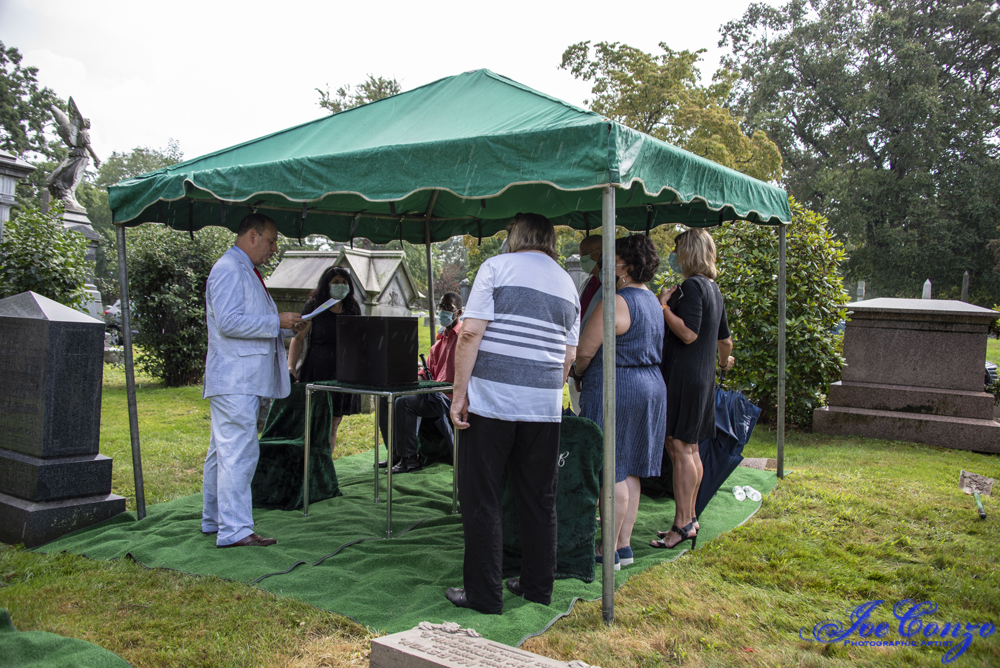 Ceremony under tent during rain. Joe Conzo, Jr, photo.