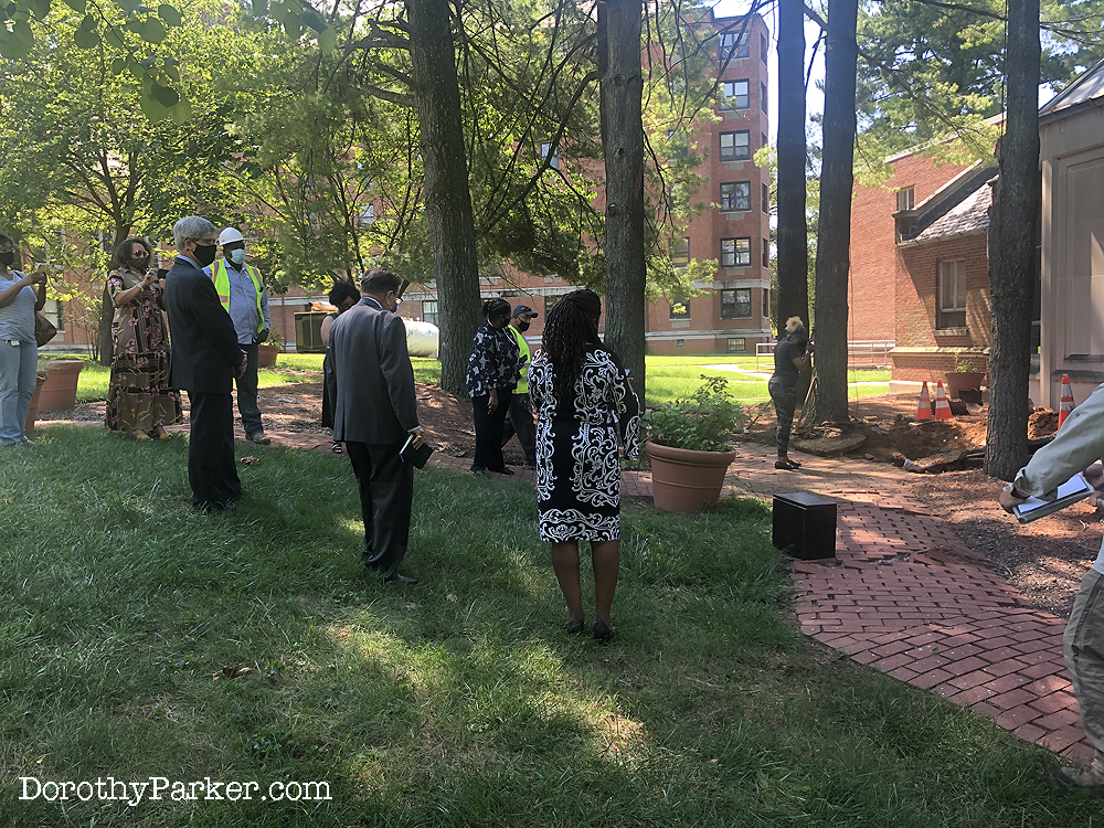 NAACP conducts socially distance ceremony after urn removed from ground.